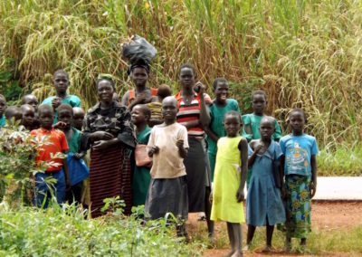 Onlooking villagers in Hoima, Uganda